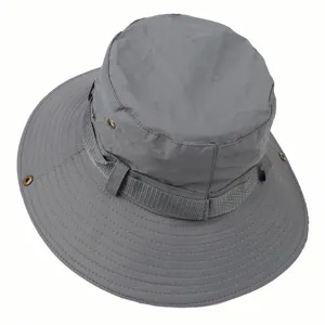 Grey outdoor sun hat detail showing breathable fabric, metal eyelets and side webbing band.