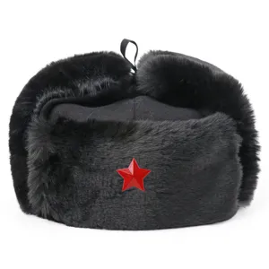 Close-up detail of the black winter ushanka hat featuring a red star badge and warm earflaps.