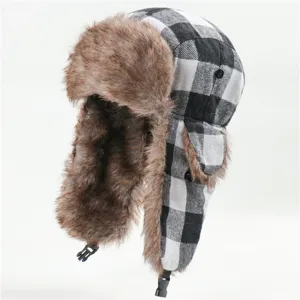 Detailed shot of the classic black and white plaid ushanka hat with warm brown faux fur lining.