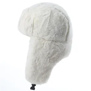 Detailed view of a white faux fur ushanka hat featuring warm earflaps and secure buckle.