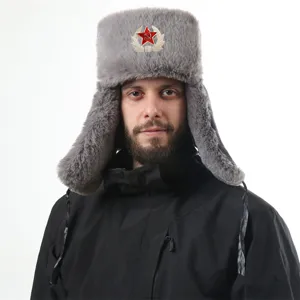 Detail view of the winter warm grey ushanka hat with Soviet red star badge and ear flaps.