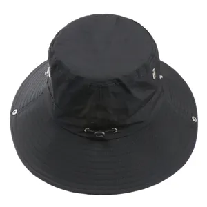 Detailed view of the black outdoor bucket hat featuring an adjustable cord for hiking.