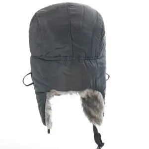 Detail view of the black winter bomber hat, thick windproof ushanka with cozy faux fur flaps.