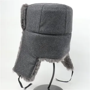 Grey wool ushanka hat detail, thick warm winter trapper hat with earflaps and chin ties.