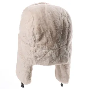 Detailed view of winter beige faux fur ushanka hat with warm earflaps for outdoor cold weather.