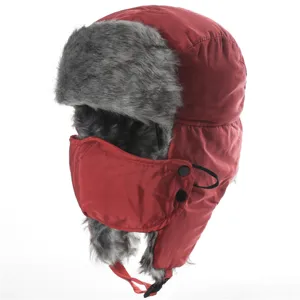 Thickened winter bomber hat with faux fur earflaps, red windproof ushanka for outdoor wear.