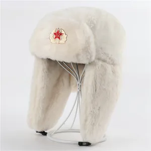 White faux fur ushanka hat detail view, classic Soviet red star badge winter trapper cap.