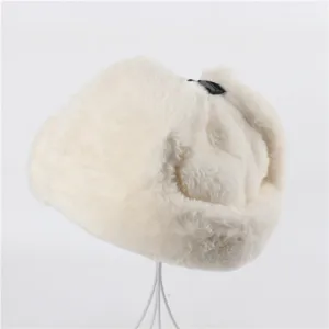 Close-up detail of the fluffy white faux fur winter ushanka hat showing soft texture.