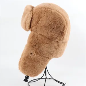 Detailed view of brown faux fur ushanka hat showing soft plush texture and warm ear flaps.