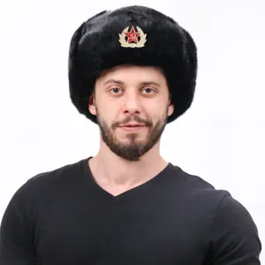 Detail shot of the classic black fur ushanka winter hat with Soviet red star metal emblem.
