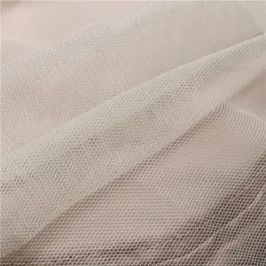 Close-up detail of fine breathable mesh fabric, showing soft texture and lightweight structure.