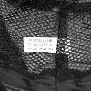 Outdoor mesh sun hat detail showing 100% polyester fabric and quality label inside.
