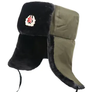 Soviet style winter ushanka hat with ear flaps, warm plush fur and iconic red star military badge.