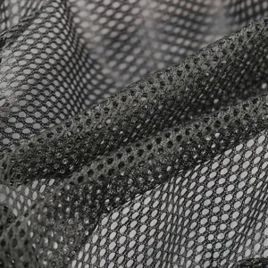 Detailed close-up view of dark gray breathable mesh fabric showing texture and holes.