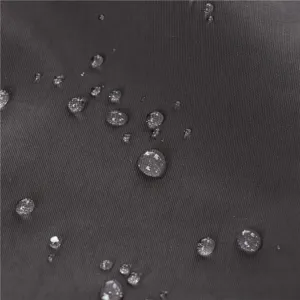 Close-up detail of waterproof fabric with water droplets for outdoor sun protection hat.