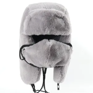 Grey faux rabbit fur ushanka hat with earflaps and mask for winter warmth and cold weather.