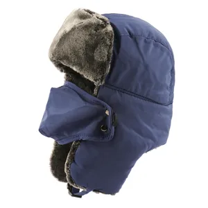 Detail view of winter bomber hat in blue with plush fur lining and windproof mask.