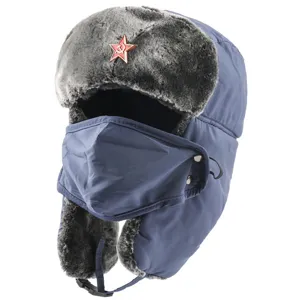 Detailed view of thick blue winter trapper hat with furry earflaps and face mask.