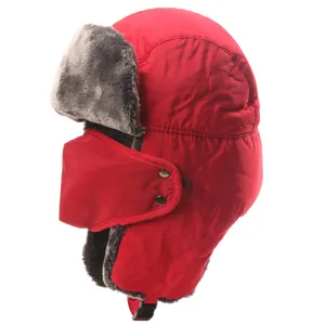 Detail view of the red winter trapper hat featuring plush faux fur lining and windproof face mask.