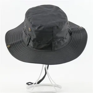Close-up detail of black outdoor bucket hat, showing fabric texture and functional ventilation.