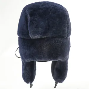 Warm winter ushanka hat with ear flaps, thick faux fur bomber cap in navy blue for cold weather.