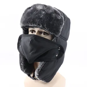 Detail view of thick warm winter ushanka bomber hat with windproof face mask for skiing.