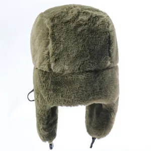 Detail view of the thick plush green trapper hat, showcasing soft fur and earflap design.