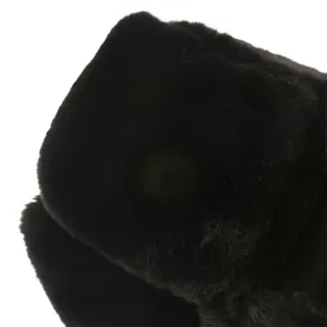 Close-up detail view of the winter warm plush ushanka hat in classic black color.
