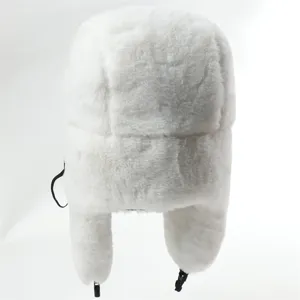 Detail view of fluffy white faux fur ushanka bomber hat showing texture and earflap design.