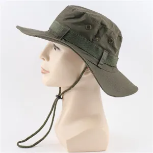 Detail view of army green cotton bucket hat with chin strap and metal eyelets for hiking.