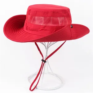 Red outdoor sun hat detail showing breathable mesh panel, wide brim, and wind cord.