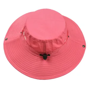 Detail view of a pink wide-brim sun hat with breathable mesh and adjustable drawstring.