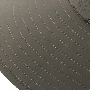 Close-up detail of outdoor sun hat brim, showing durable stitching and textured fabric.