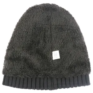 Close up of black winter knit beanie, ribbed brim, soft fleece lined warm wool hat detail.