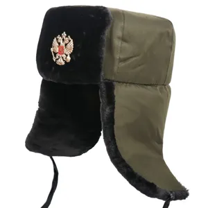 Detailed view of military style winter ushanka hat with plush earflaps and metal emblem.