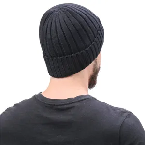 Detailed back view of a black ribbed knit beanie hat, showing winter warm fleece lining design.