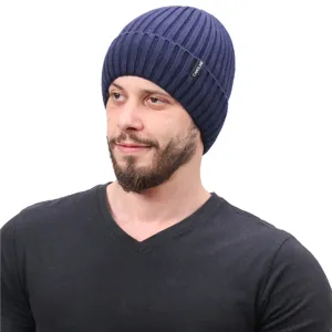 Close-up detail of the dark blue ribbed knit winter beanie hat with small brand tag.