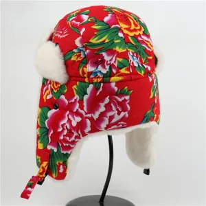 Thickened winter earflap hat with classic red floral pattern, warm faux fur lining design.