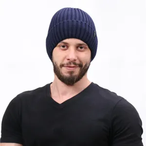 Mens winter warm knitted beanie hat, dark blue ribbed design for outdoor cold weather wear.
