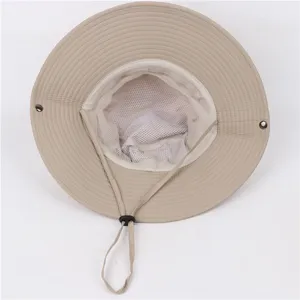 Detail view of wide brim sun bucket hat with mesh lining and wind rope, khaki outdoor headwear.
