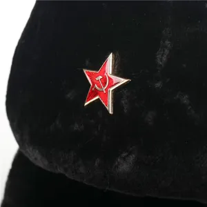 Detailed view of winter ushanka hat with iconic red star emblem for extreme cold weather protection.