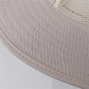 Close-up detail of outdoor sun hat brim, featuring durable stitching and breathable mesh.