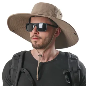 Detail view of khaki wide-brim sun hat with chin strap and breathable design for outdoor travel.