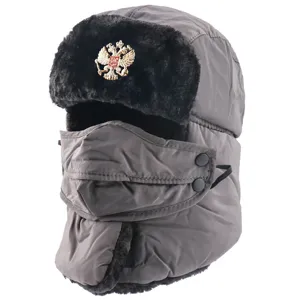 Detailed view of the thick fleece winter ushanka hat with face mask and Russian emblem.
