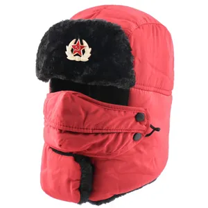Detailed view of the red winter ushanka hat with plush earflaps and Soviet star badge.