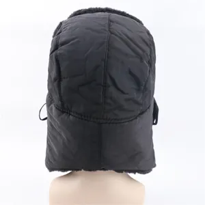 Back detail view of black quilted winter bomber hat, warm ear-flap design for cold weather.
