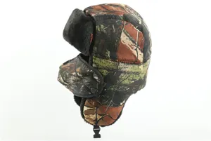 Detailed view of winter camouflage ushanka hat with thick plush earflaps and windproof design.