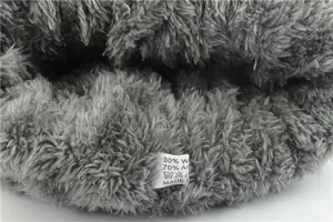 Winter warm fleece lined knitted beanie hat interior detail showing thick plush fabric texture