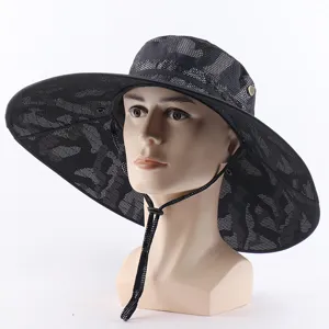 Detail view of the camouflage wide-brim sun fishing hat with mesh shawl and chin cord.