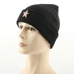 Black knit beanie hat featuring a Soviet star hammer and sickle metal badge, unisex winter cap.